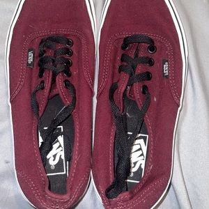 Women’s burgundy low cut vans.